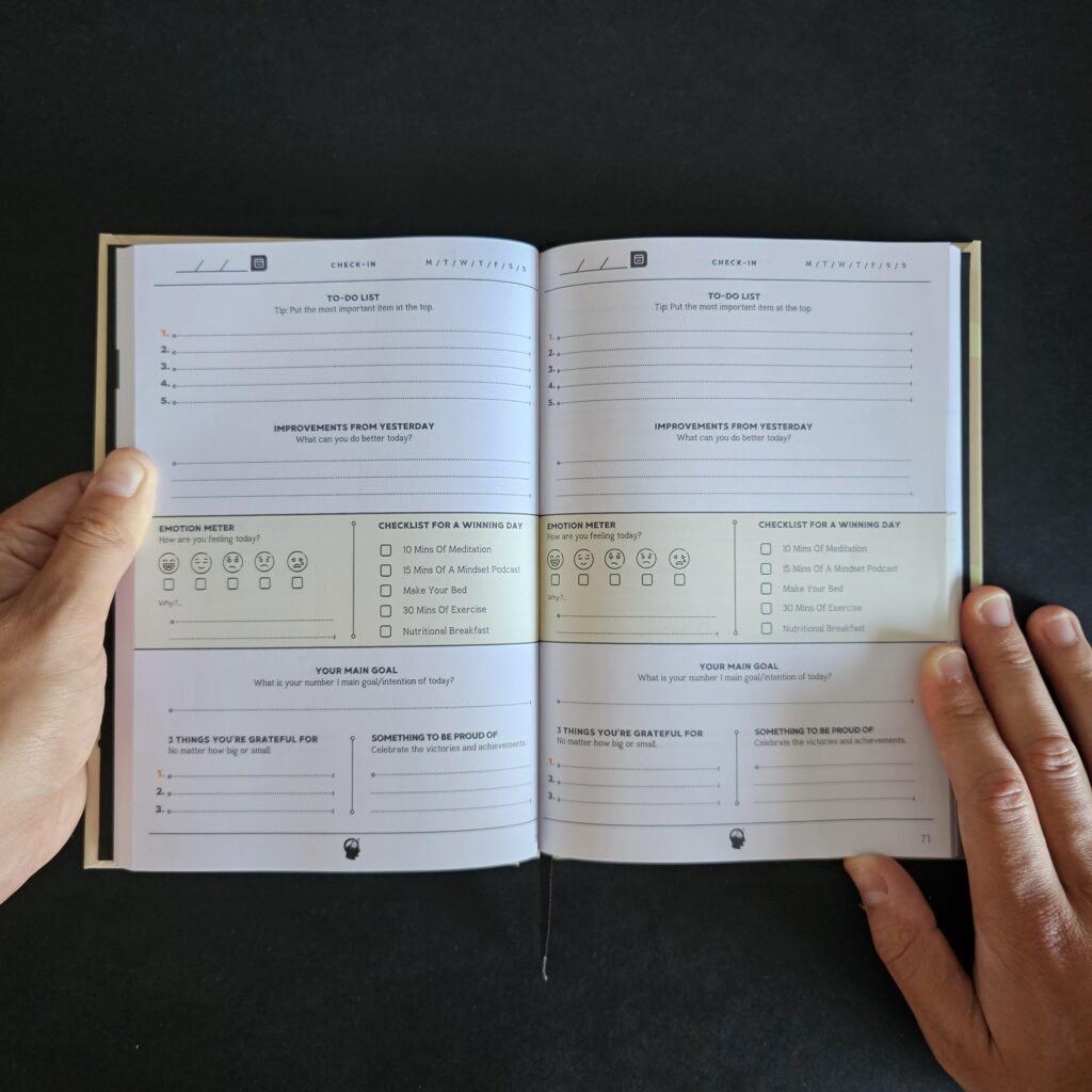The inside of a Mental health journal showing a page that discusses goal setting, gratitude and tracking your emotions.